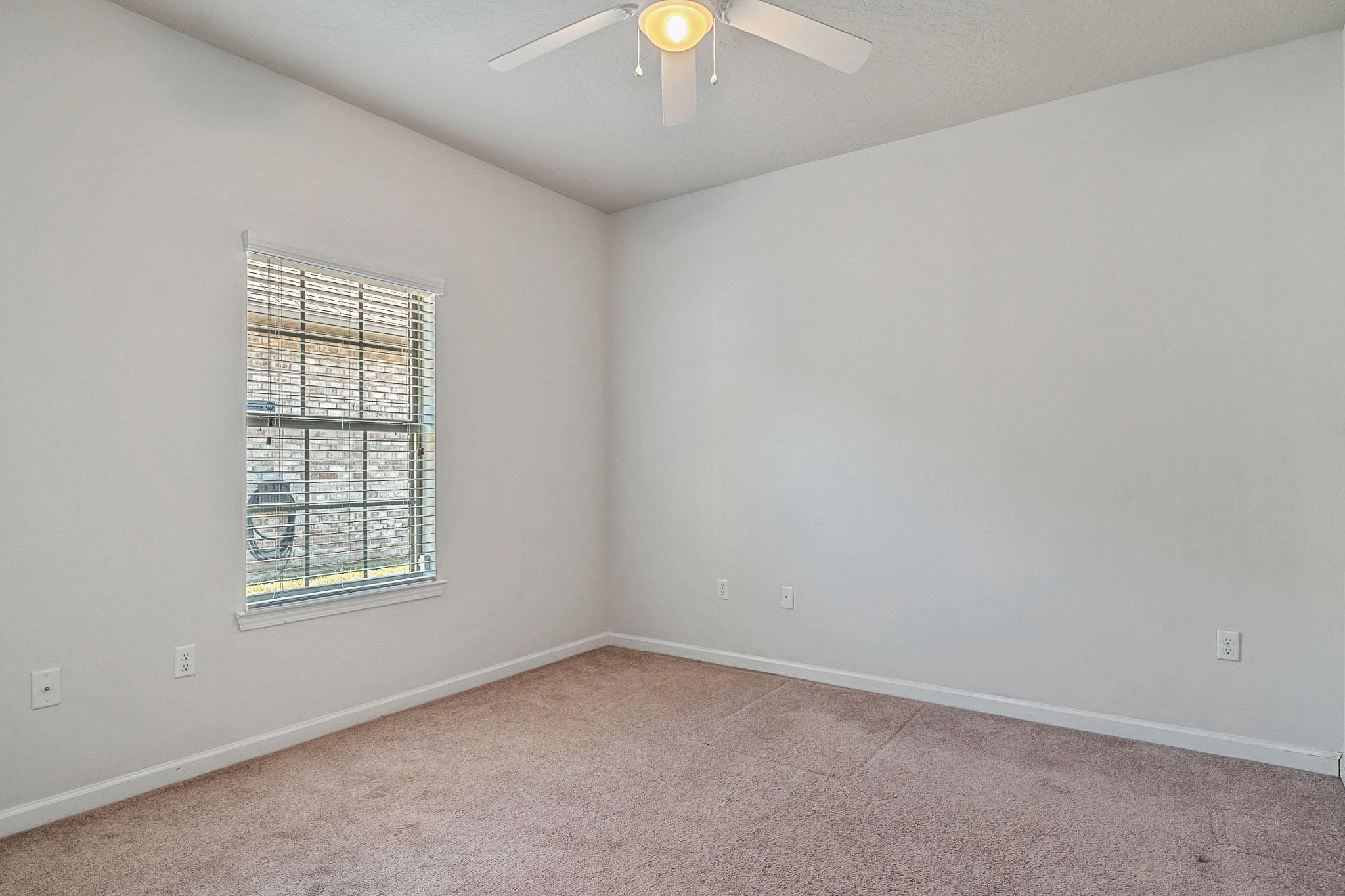 4592 Hermosa Road Crestview, FL 32539 - Photo 18 of 32 an empty room with windows and chandelier fan