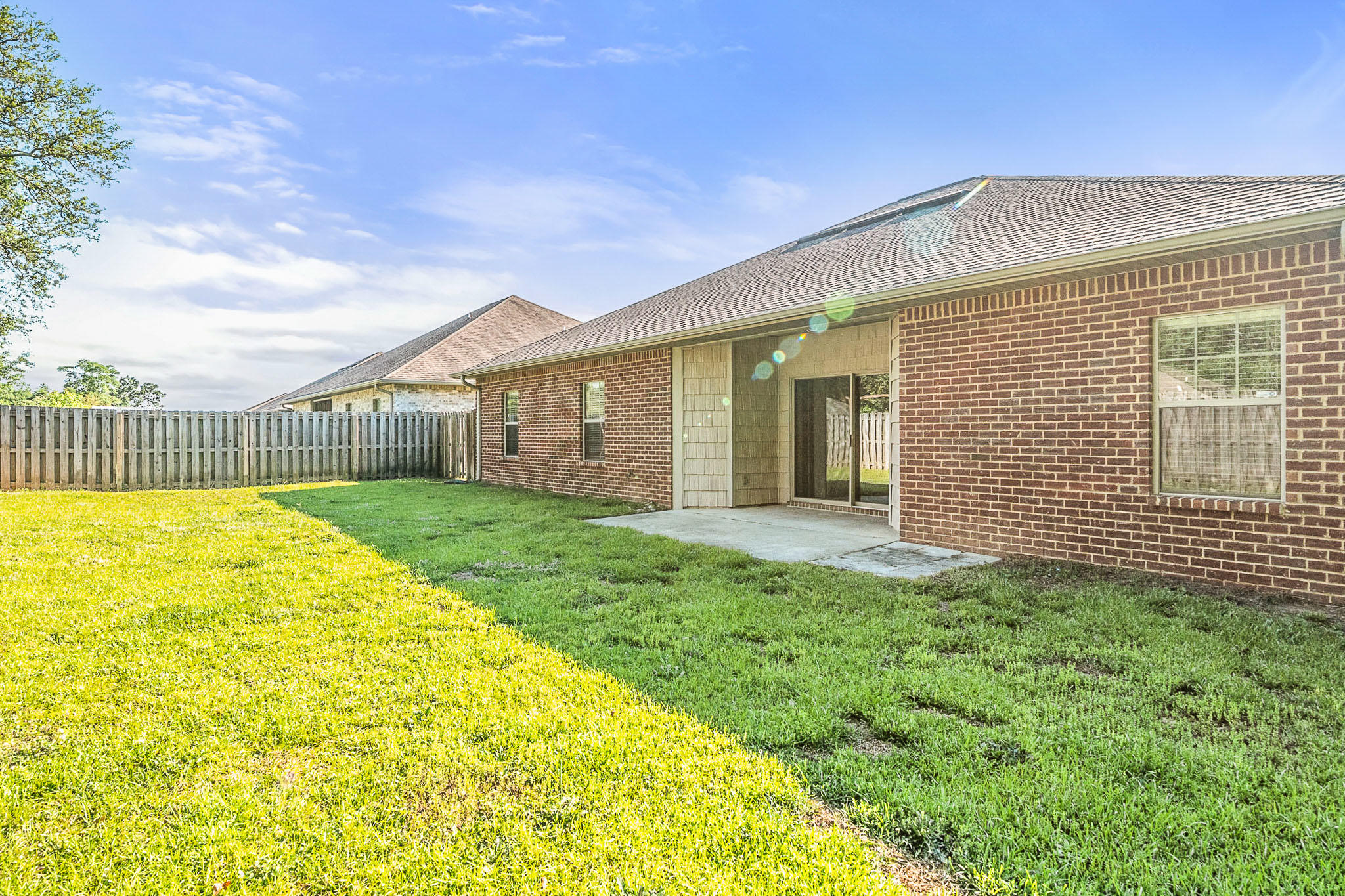 4592 Hermosa Road Crestview, FL 32539 - Photo 30 of 32 a view of an house with backyard and porch