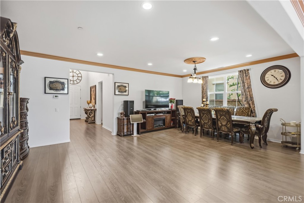 3380 Pine Ridge Loop Ontario, CA 91761 - Photo 5 of 37 a living room with furniture and wooden floor