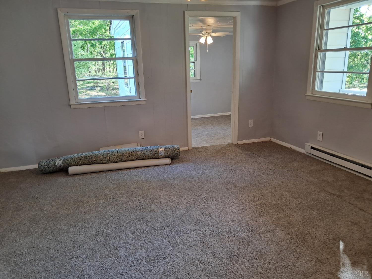 6019 Wards Road Evington, VA 24550 - Photo 11 of 32 an empty room with windows
