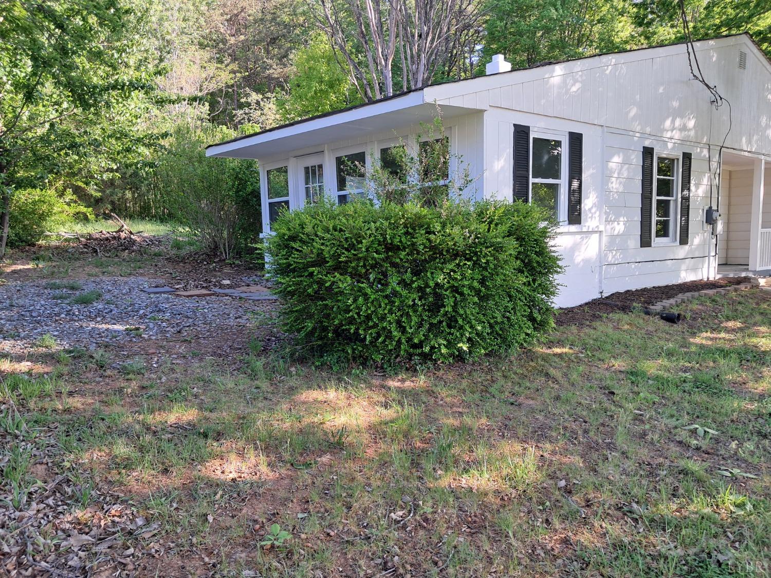 6019 Wards Road Evington, VA 24550 - Photo 30 of 32 a front view of a house with garden