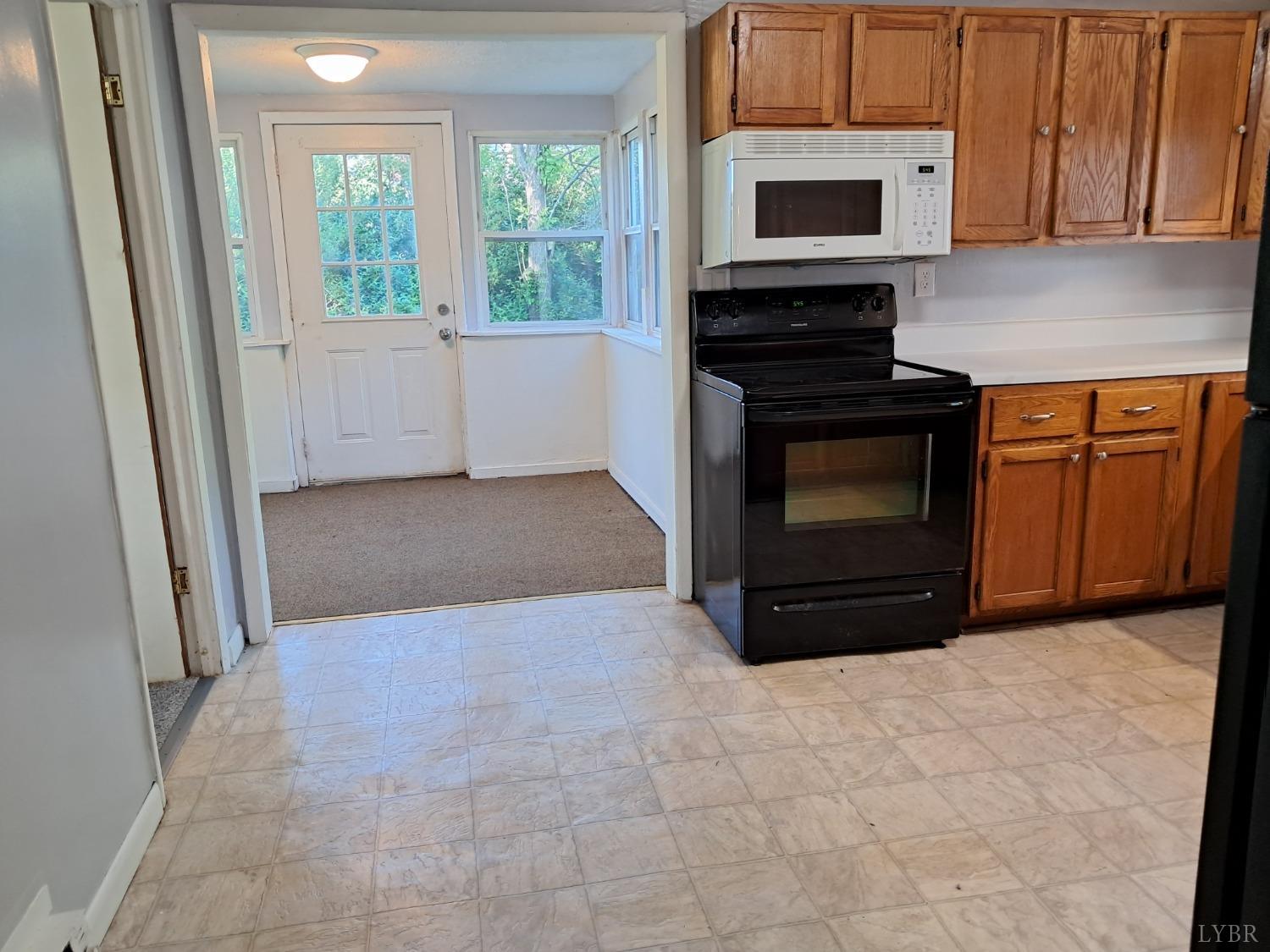 6019 Wards Road Evington, VA 24550 - Photo 4 of 32 a view of kitchen with stove and microwave