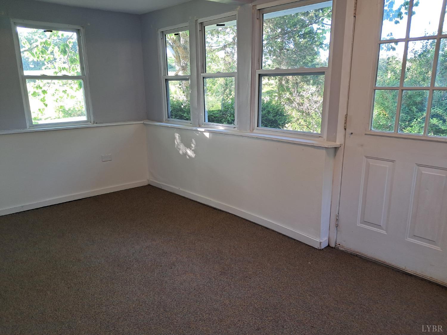 6019 Wards Road Evington, VA 24550 - Photo 6 of 32 an empty room with a window