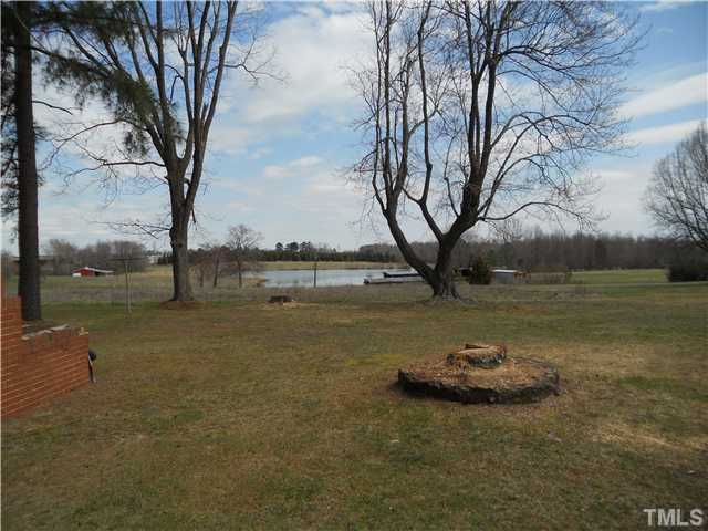2505 Old Durham Road Roxboro, NC 27573 - Photo 17 of 18 a view of a lake with a yard