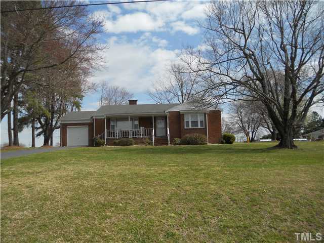 2505 Old Durham Road Roxboro, NC 27573 - Photo 18 of 18 a front view of a house with a garden