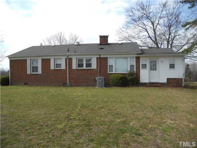 2505 Old Durham Road Roxboro, NC 27573 - Photo 3 of 18 a front view of a house with garden