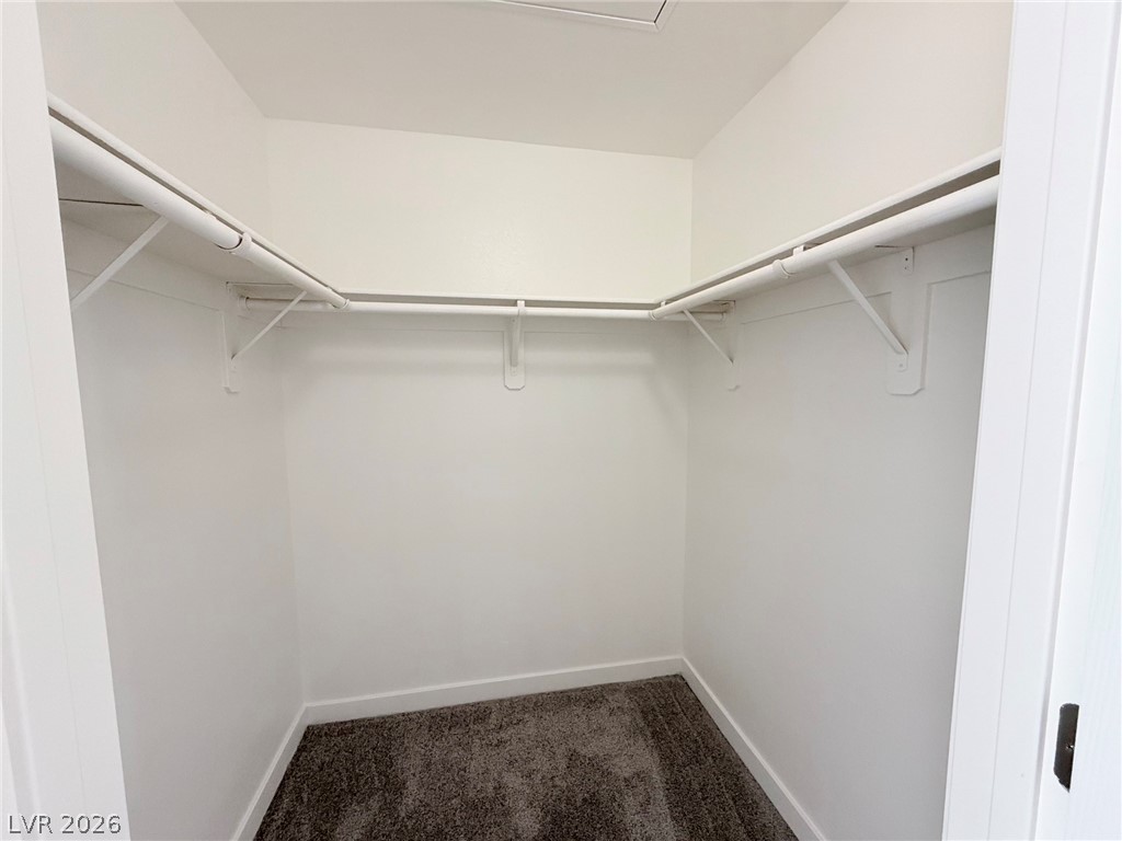 9050 West Warm Springs Road, Unit 2002 Las Vegas, NV 89148 - Photo 28 of 46 This spacious closet offers ample storage and organization for your wardrobe needs.
