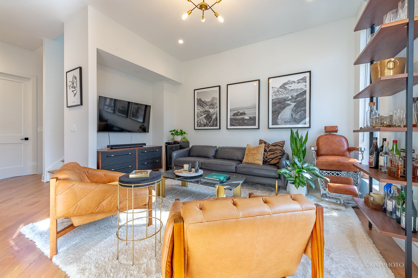 15 North Ada Street Chicago, IL 60607 - Photo 17 of 41 a living room with furniture a flat screen tv and a fireplace