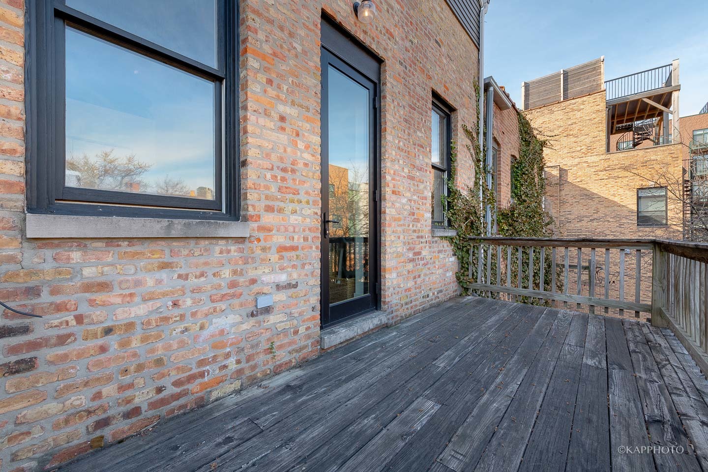 15 North Ada Street Chicago, IL 60607 - Photo 25 of 41 a view of a brick house with wooden floor and a wall painting