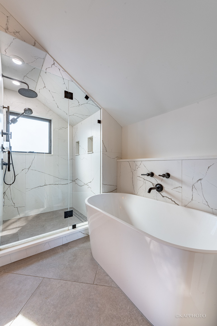 15 North Ada Street Chicago, IL 60607 - Photo 30 of 41 a bathroom with a bathtub and shower