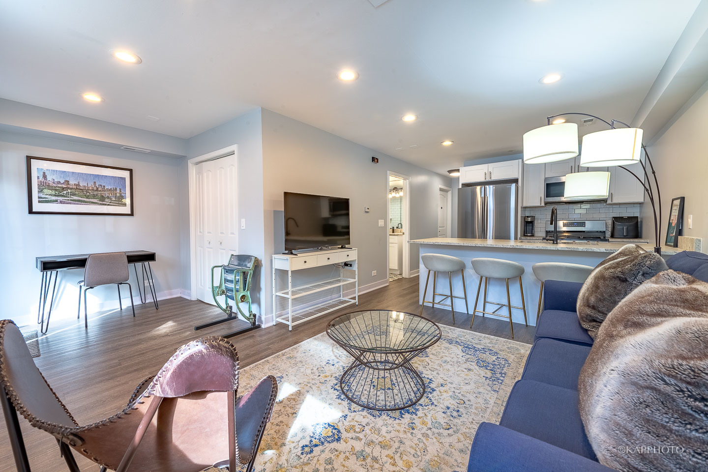 15 North Ada Street Chicago, IL 60607 - Photo 37 of 41 a living room with furniture and a flat screen tv
