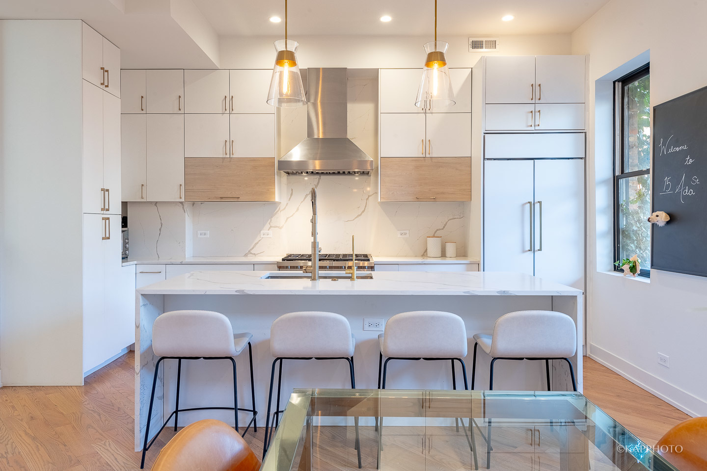 15 North Ada Street Chicago, IL 60607 - Photo 9 of 41 a kitchen with cabinets and chairs