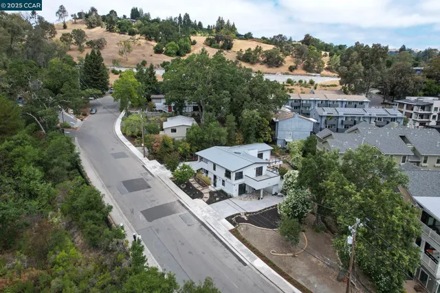 an aerial view of a house with outdoor space