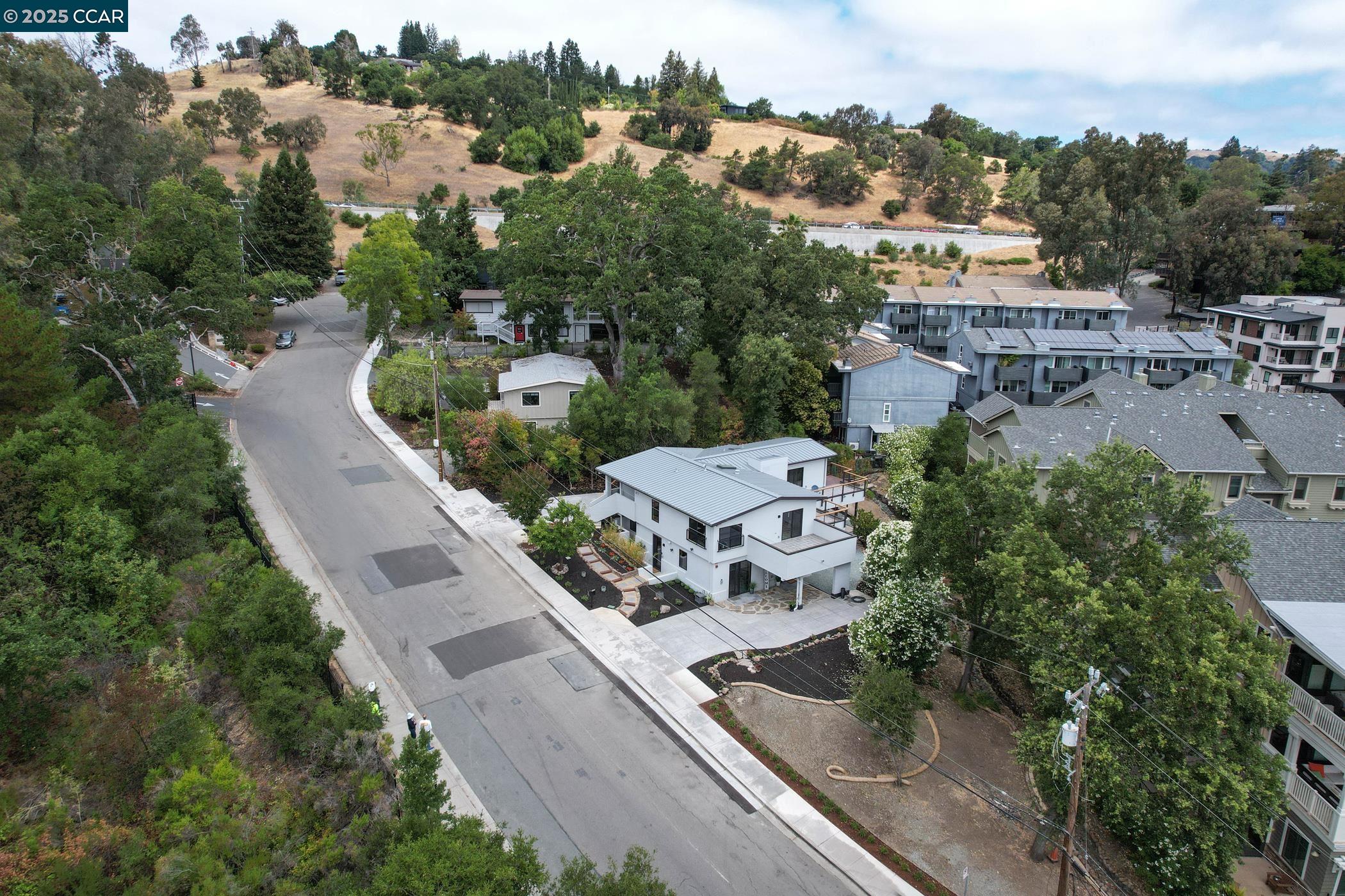 an aerial view of a house with outdoor space