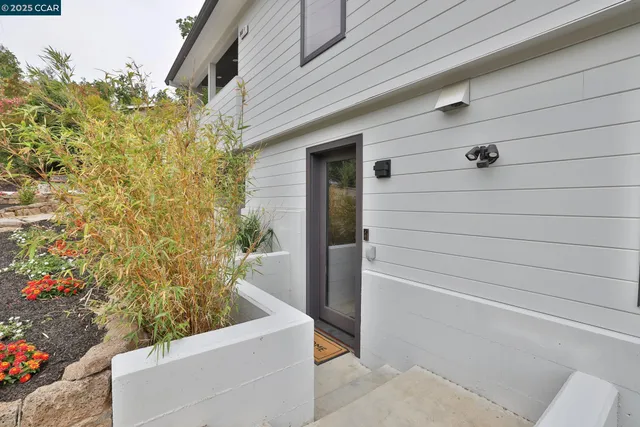 a view of a door and chair in a patio
