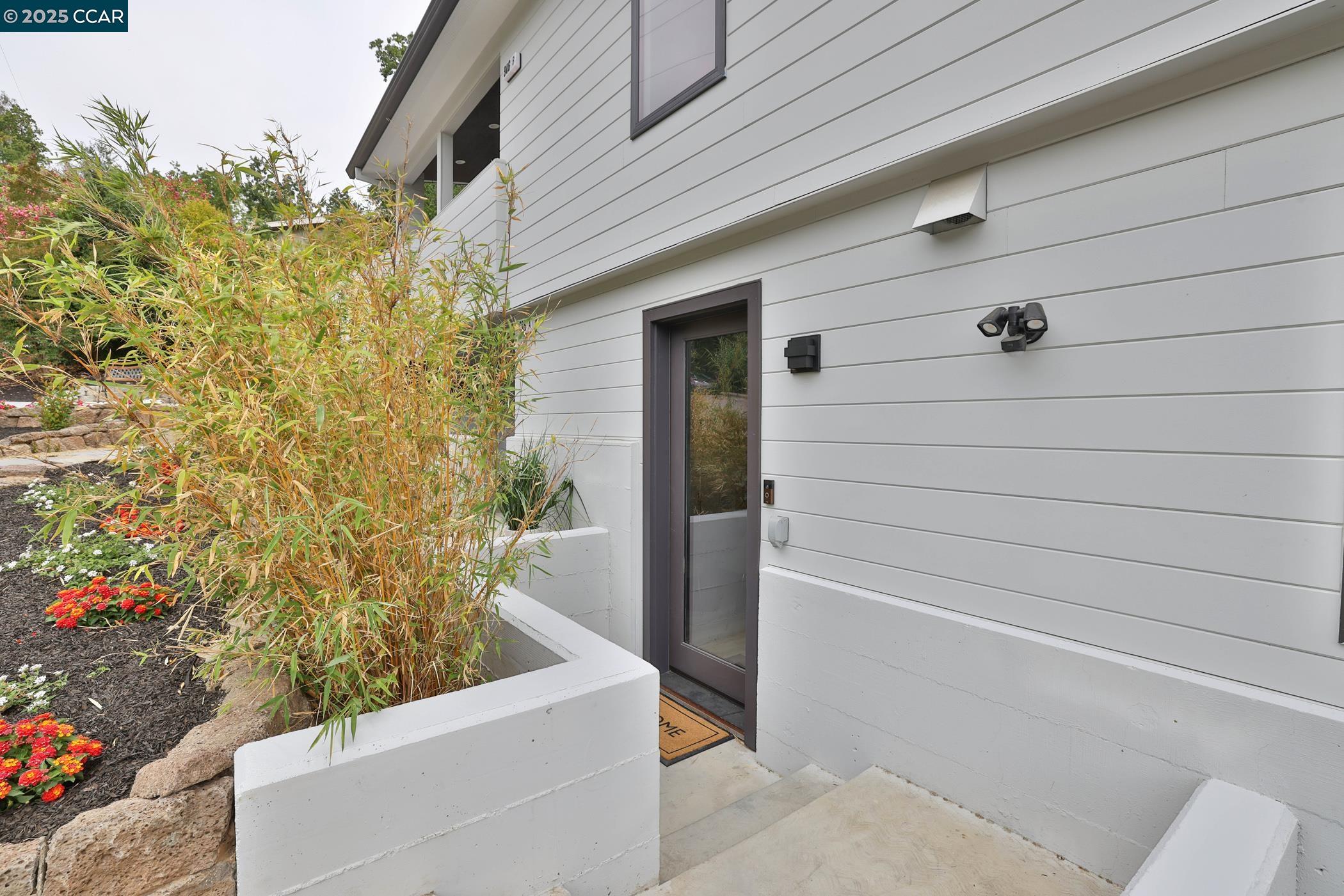 946 Risa Road, Unit A Lafayette, CA 94549 - Photo 14 of 17 a view of a door and chair in a patio