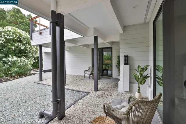 a view of an entryway with backyard of the house