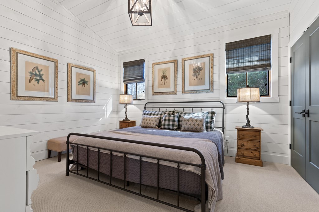 106 Little Rock Creek Road Cherry Log, GA 30522 - Photo 29 of 95 a bedroom with a bed a table and painting on the wall