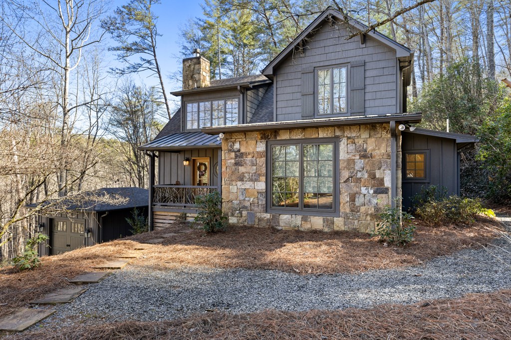 106 Little Rock Creek Road Cherry Log, GA 30522 - Photo 50 of 95 a front view of a house with a yard and garage