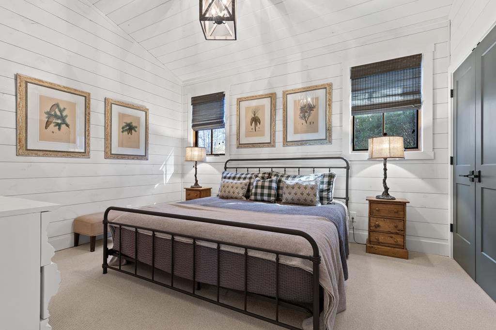 106 Little Rock Creek Road Cherry Log, GA 30522 - Photo 79 of 95 a bedroom with a bed a table and painting on the wall