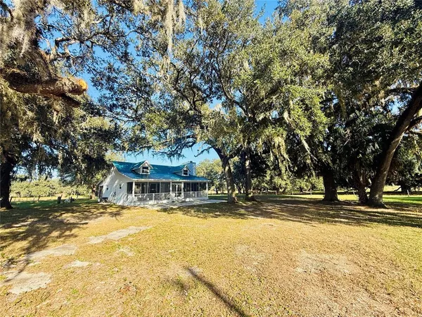 a view of a lake with a yard