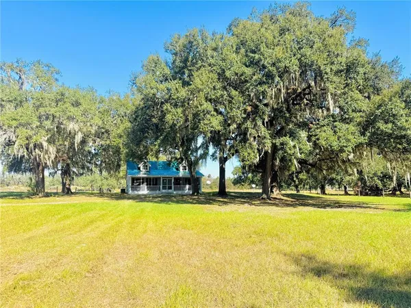 a front view of house with yard and garden