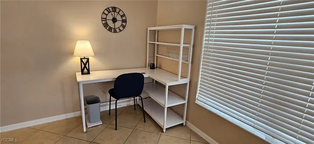 a view of a dining room with furniture and window