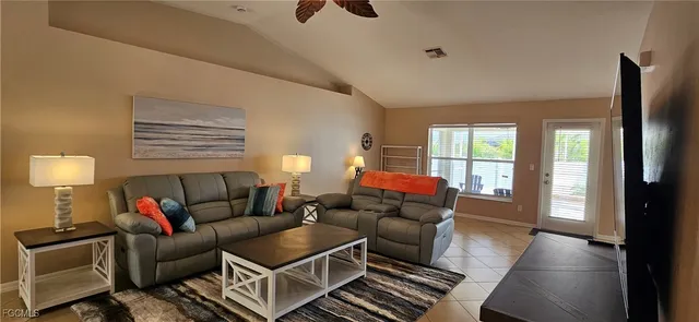 a kitchen with stainless steel appliances granite countertop a refrigerator stove top oven and sink