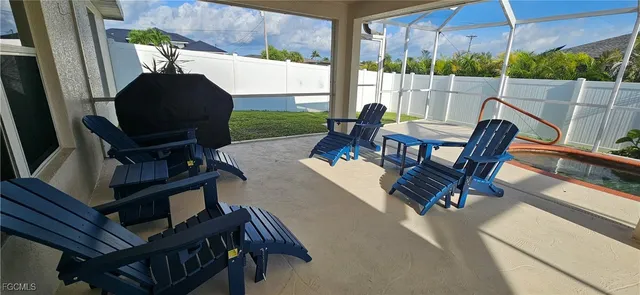 a view of living room with balcony and furniture