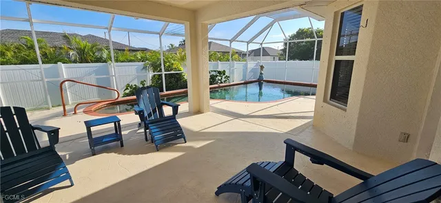 a view of a balcony with furniture