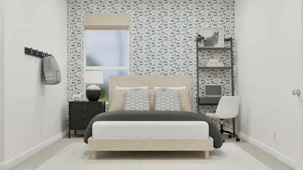 a bed sitting in a bedroom next to a window with lamp