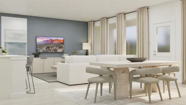a living room with furniture a window and a flat screen tv