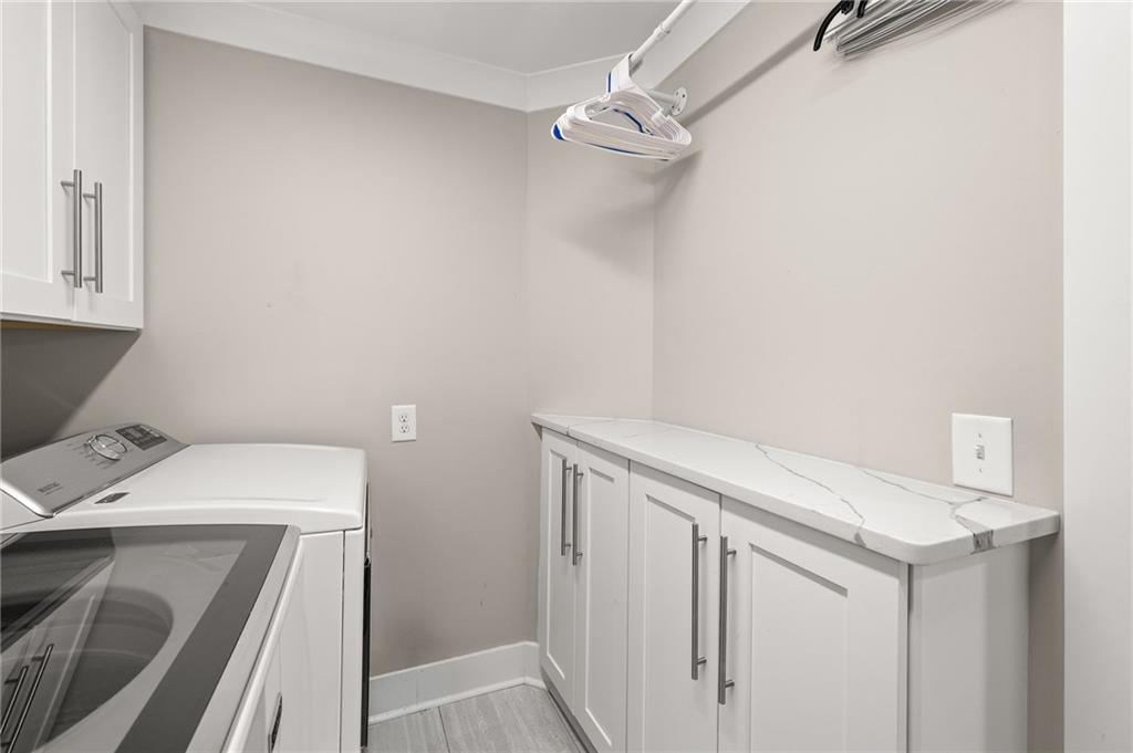 6470 Samoa Way Flowery Branch, GA 30542 - Photo 48 of 61 a utility room with dryer and washer