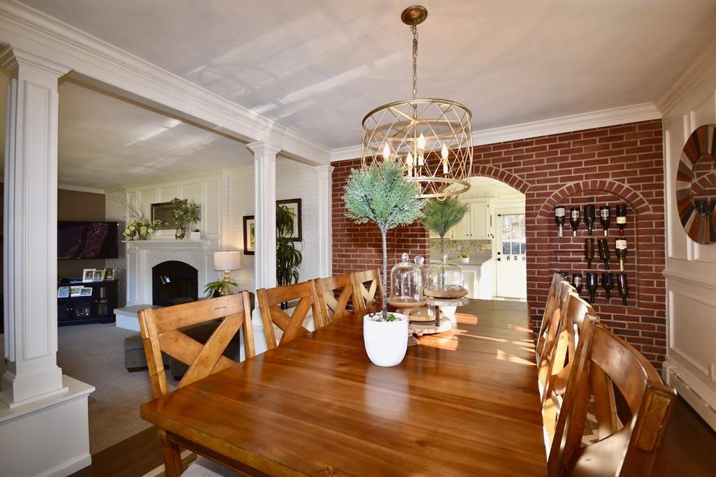 86 Snipatuit Road Rochester, MA 02770 - Photo 14 of 36 a view of a dining room with furniture a chandelier and wooden floor