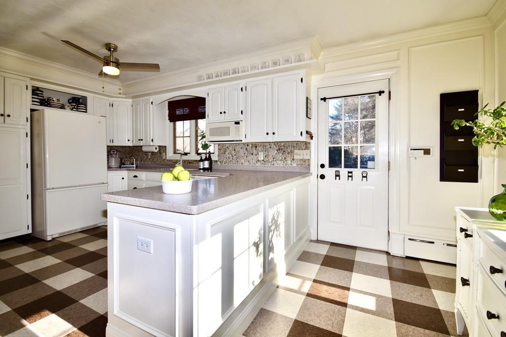 86 Snipatuit Road Rochester, MA 02770 - Photo 18 of 36 a kitchen with stainless steel appliances granite countertop a sink and a refrigerator