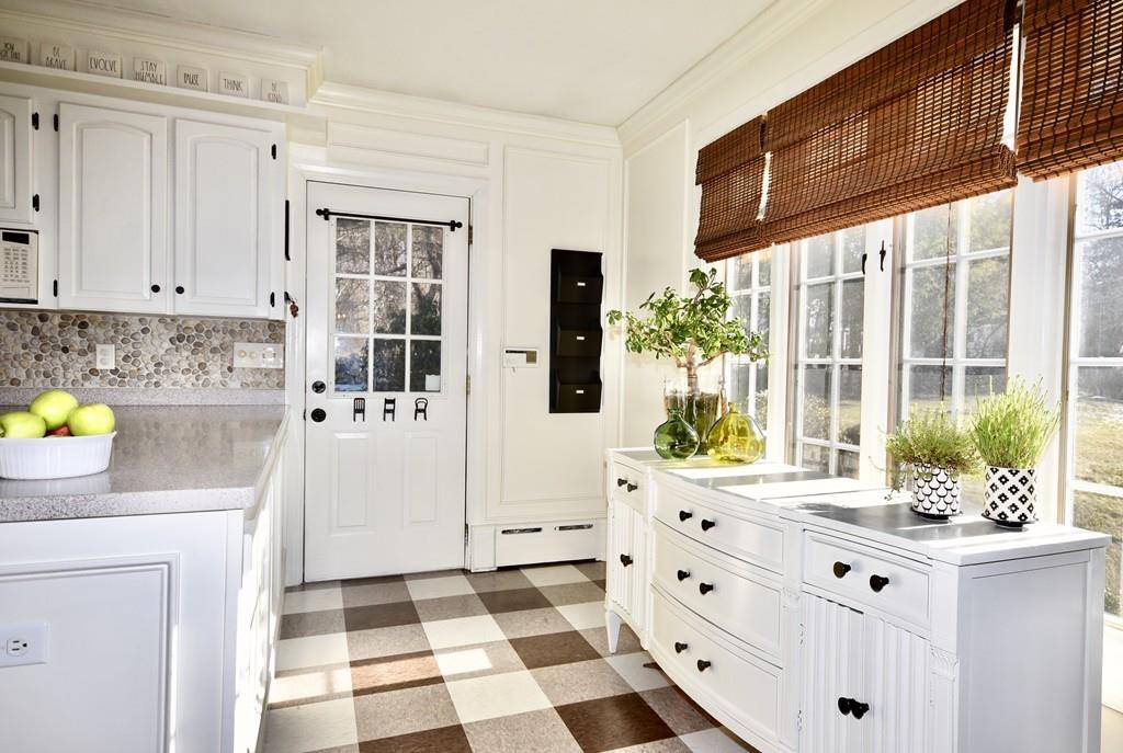86 Snipatuit Road Rochester, MA 02770 - Photo 20 of 36 a kitchen with stainless steel appliances a white refrigerator a stove a sink and a dining table with wooden floor