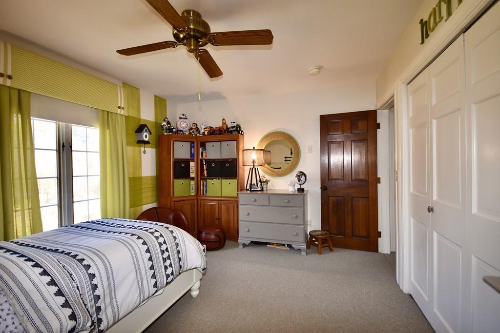 86 Snipatuit Road Rochester, MA 02770 - Photo 26 of 36 a bed room with a bed and a mirror