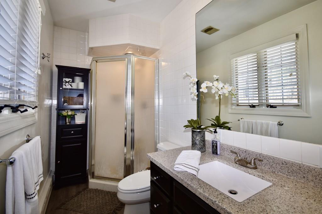 86 Snipatuit Road Rochester, MA 02770 - Photo 31 of 36 a bathroom with a granite countertop sink toilet and shower