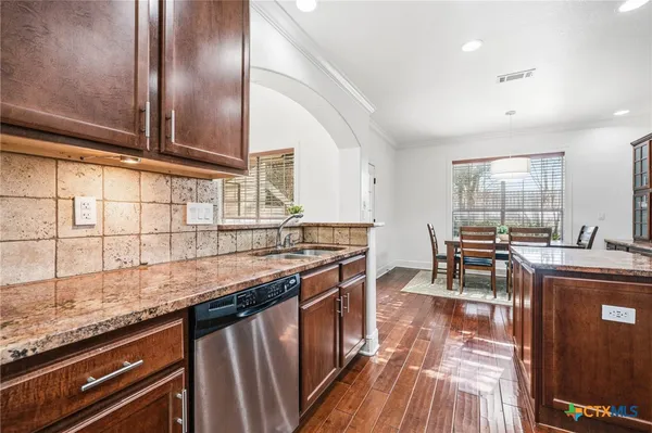 a bedroom with a bed and a ceiling fan