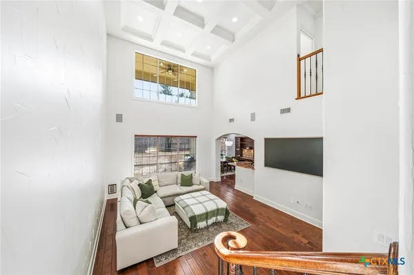 a spacious bathroom with a sink and a mirror