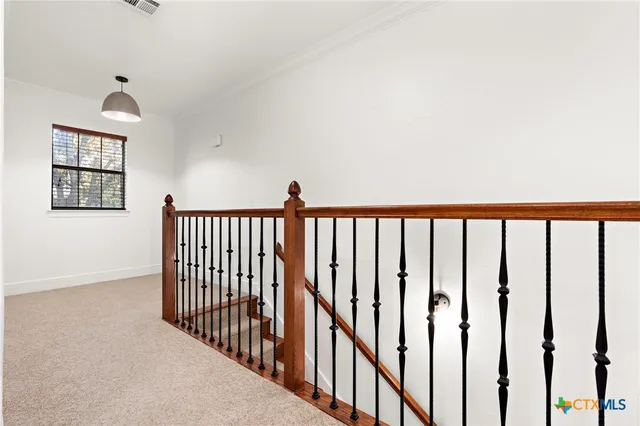 a view of a hallway with a white walls