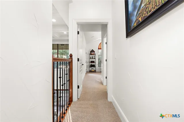 a spacious bedroom with a bed a couch and a window