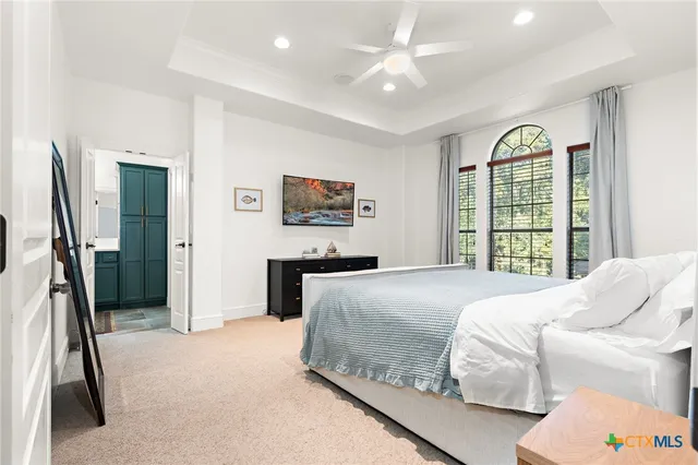 a bathroom with a sink a toilet a shower and a mirror