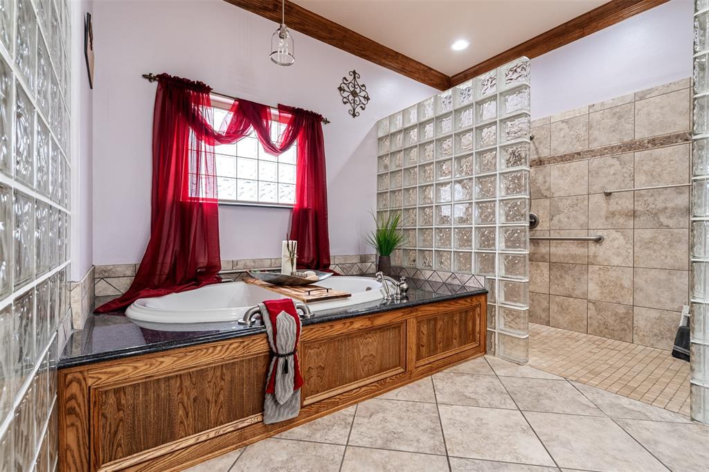 145 County Road 2327 Decatur, TX 76234 - Photo 25 of 40 Relax in the oversized jetted tub or rinse off in the spacious walk-in shower.