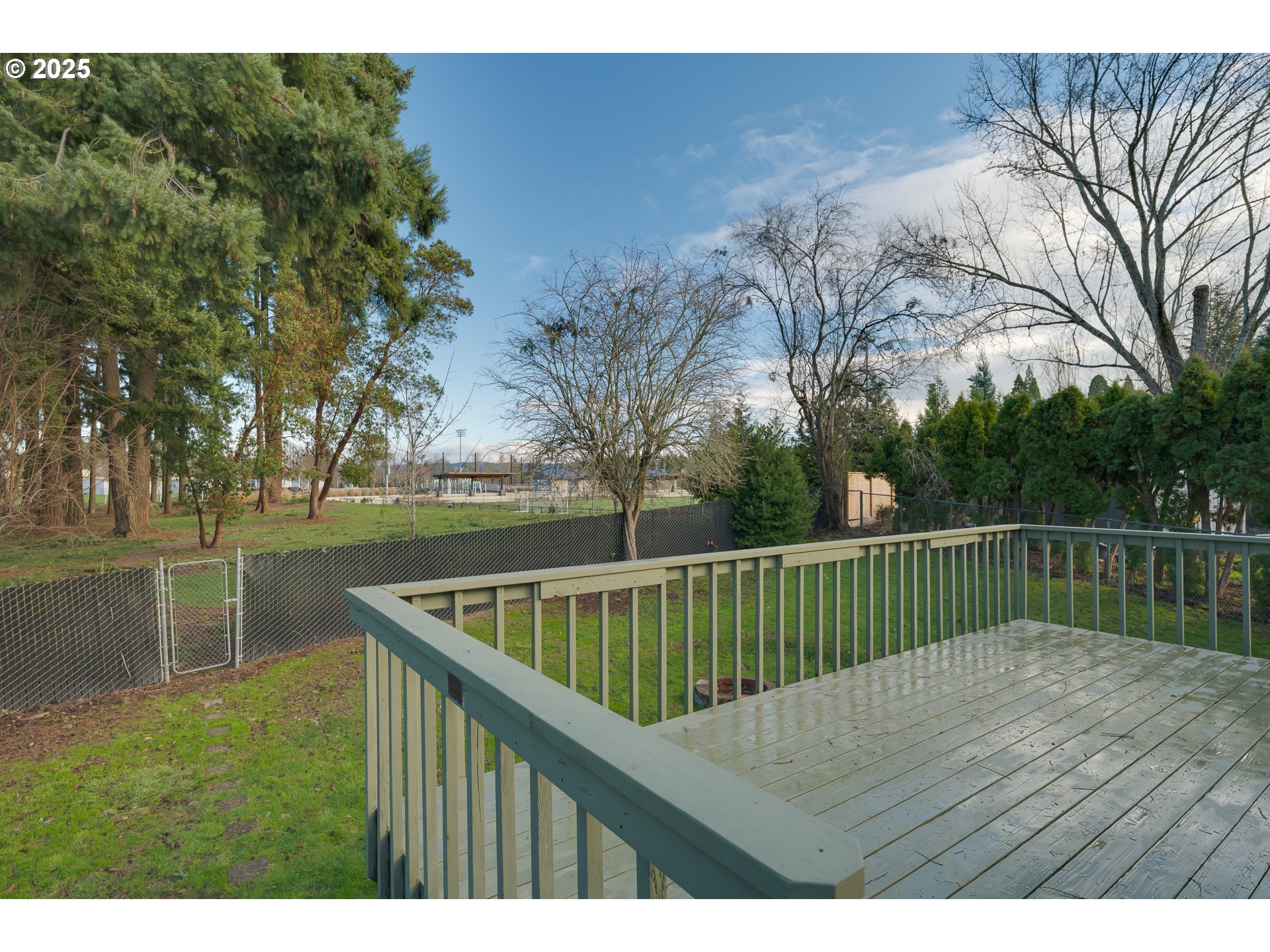 5970 Southwest 174th Avenue Beaverton, OR 97007 - Photo 23 of 36 a view of deck with mountain view and trees