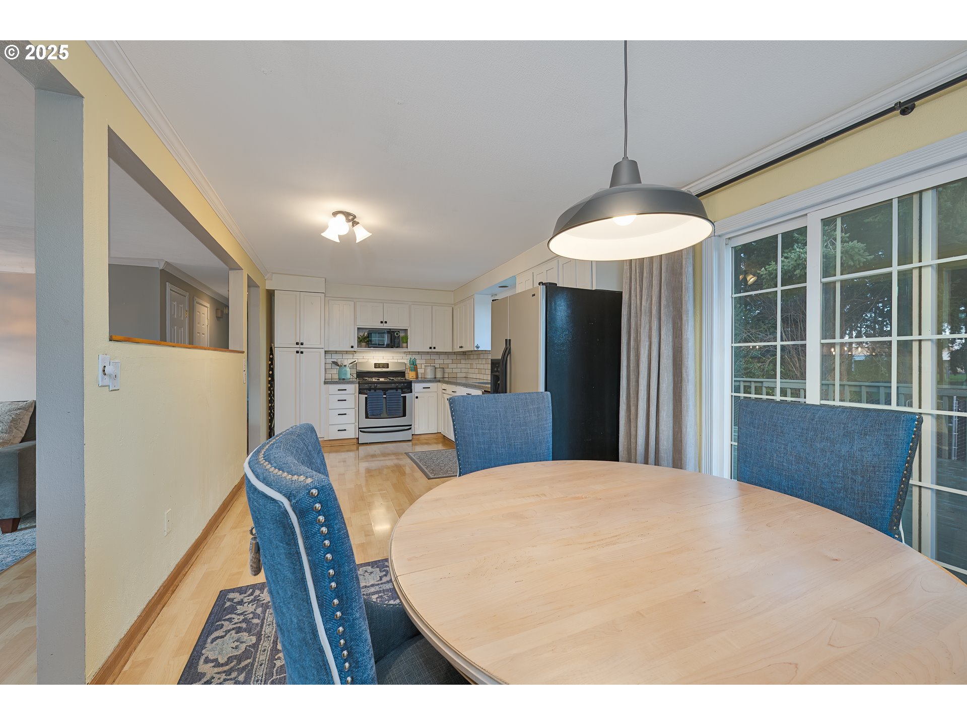 5970 Southwest 174th Avenue Beaverton, OR 97007 - Photo 8 of 36 a view of a dining room with furniture window and wooden floor