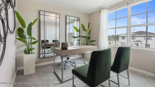 a dining room with furniture and window