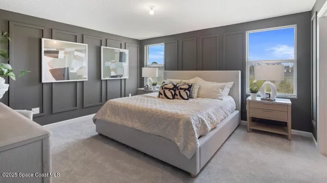 a bedroom with a bed and a view of bathroom