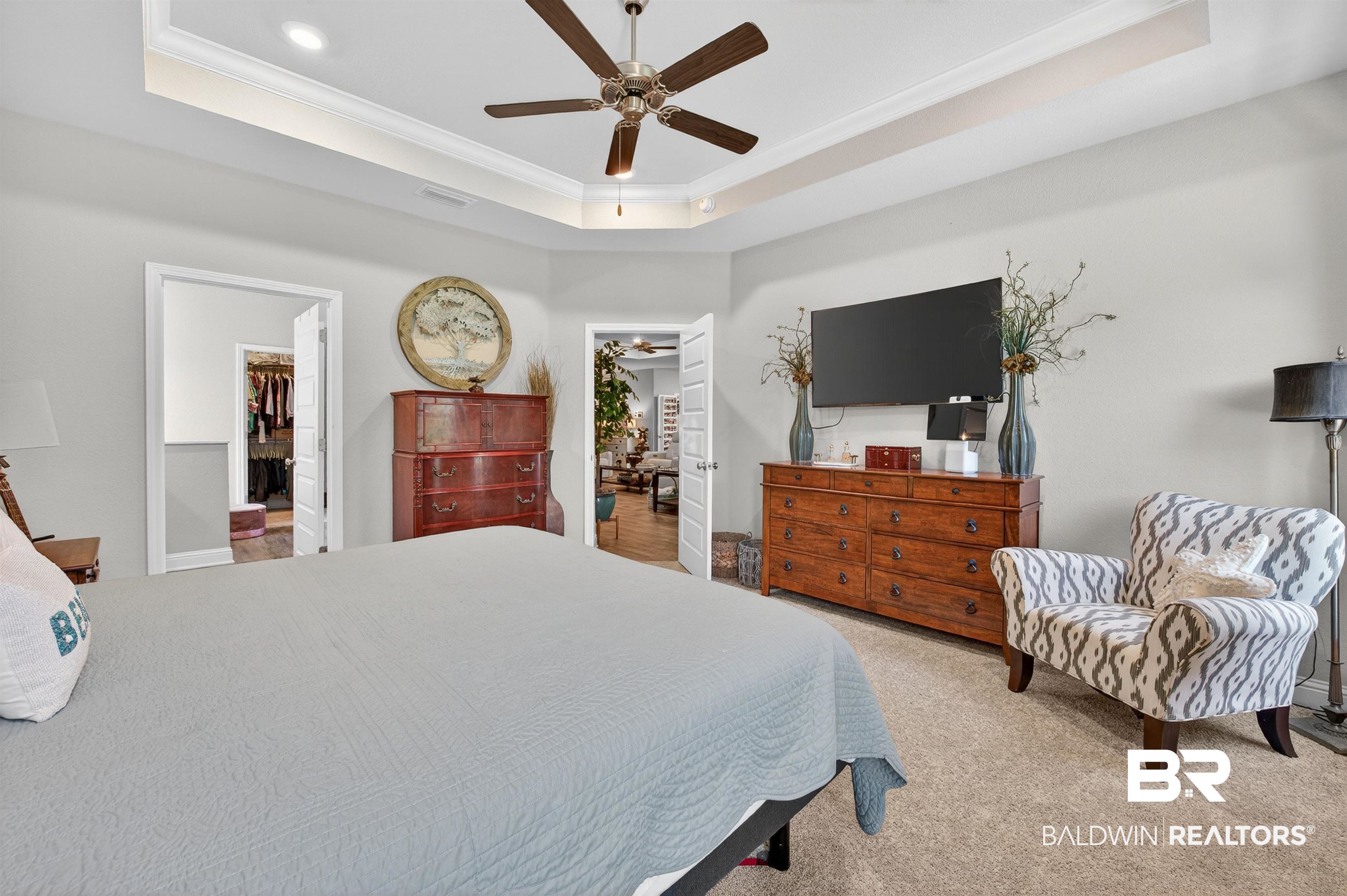 8735 Bronze Lane Foley, AL 36535 - Photo 23 of 58 Carpeted room featuring a tray ceiling with a ceiling fan and recessed lighting