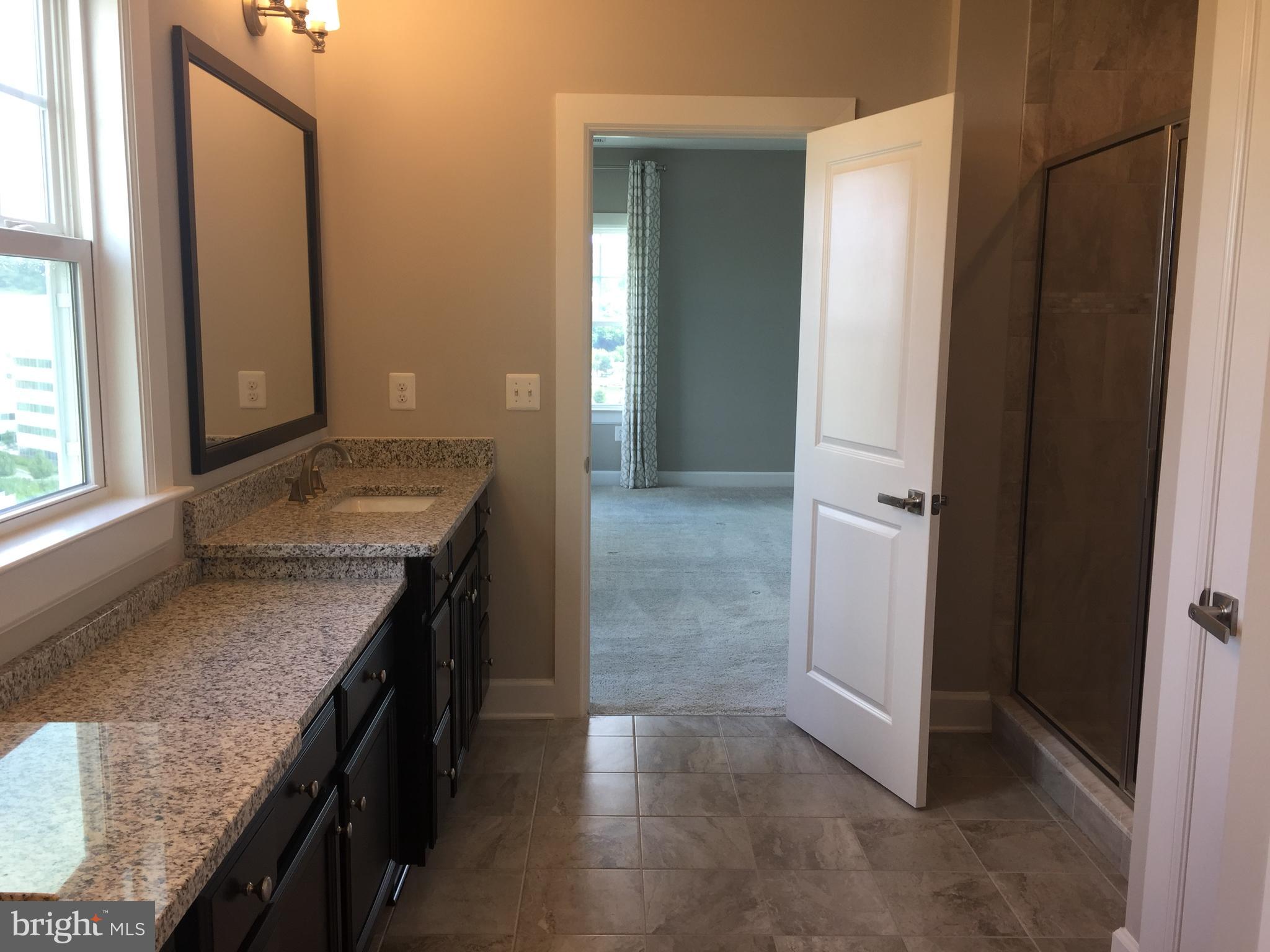 503 Cliff Lane Malvern, PA 19355 - Photo 12 of 38 a bathroom with a granite countertop sink and a mirror
